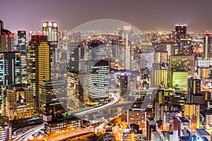 Osaka cityscapes with long traffic light trails at night photo