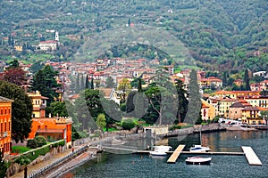 Scenery of Lenno in Lombardy Italy, a lakeside town by Lago di Como with view of ferry boats parking by the dock