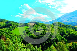 Scenery from Montefortino with Marche hills, trees and Sibillini mountains photo