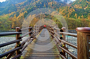 Scenery of Myojin bridge in late autumn at Kamikochi National Park, Matsumoto, Nagano, Japan