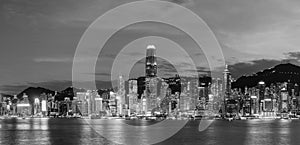 Scenery of panorama of Victoria harbor of Hong Kong city at dusk in black and white