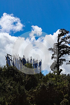 Scenery with prayer flags near Druk Wangyal Khangzang Stupa with 108 chortens, Dochula Pass, Bhutan.