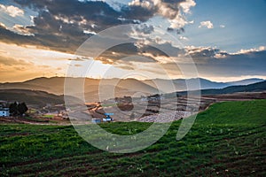 The scenery of red soil under the sunset