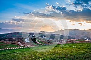 The scenery of red soil under the sunset