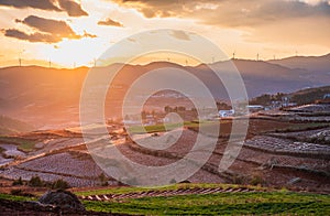 The scenery of red soil under the sunset