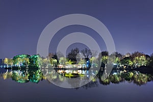 Scenery reflected in West lake at night, Hangzhou, China