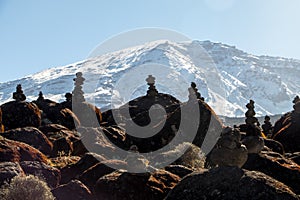 Scenery, rock piles and hiking trail on the slope of Mount Kilimanjaro