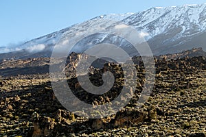 Scenery, rock piles and hiking trail on the slope of Mount Kilimanjaro