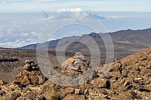 Scenery, rock piles and hiking trail on the slope of Mount Kilimanjaro