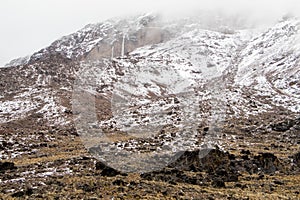 Scenery, rock piles and hiking trail on the slope of Mount Kilimanjaro