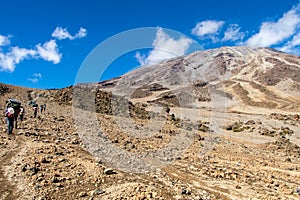 Scenery, rock piles and hiking trail on the slope of Mount Kilimanjaro