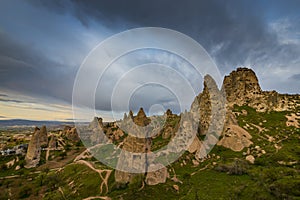 Scenery in the Romanian Alps, with stormy cloudscape and granite slabs