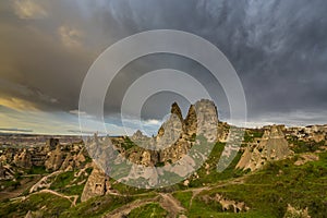 Scenery in the Romanian Alps, with stormy cloudscape and granite slabs