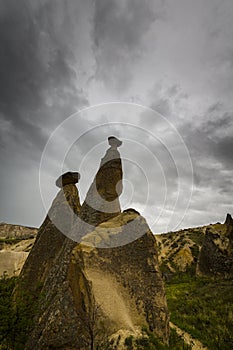 Scenery in the Romanian Alps, with stormy cloudscape and granite slabs