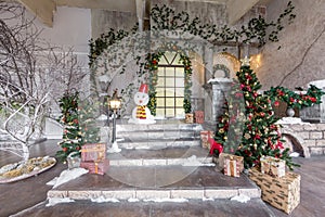 The scenery of the Studio or theater. Entrance in an old architecture with staircase and columns. Christmas decoration