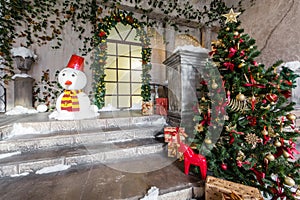 The scenery of the Studio or theater. Entrance in an old architecture with staircase and columns. Christmas decoration