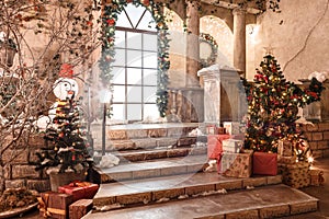 The scenery of the Studio or theater. Entrance in an old architecture with staircase and columns. Christmas decoration