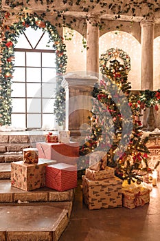 The scenery of the Studio or theater. Entrance in an old architecture with staircase and columns. Christmas decoration