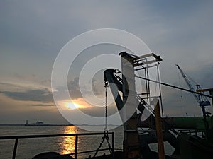 Scenery of a sunset on the shore take from a ship