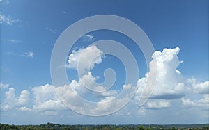 Scenery under clear blue sky with white clouds, nature background