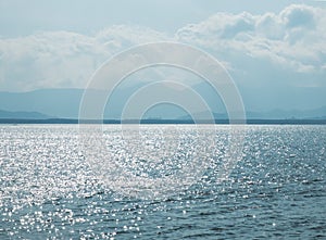 Scenery View of Ocean with Sunlight Shade Reflection in Myanmar and Sunny Sky Clouds and Island on Blue Horizon Ocean in Backgroun