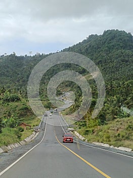 Scenery view on the up-down and winding road on the hills