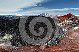 Scenery volcanic landscape - frozen lava field in colorful crater of active volcano