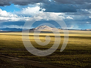 Scenery of Xinjiang Plateau Mountains and Grassland Pasture in Autumn, Chinat photo