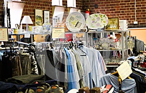 Scenes from a local Australian op-shop thrift store full of recycled clothes, home wares and books photo