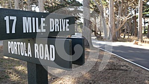 Scenic 17-mile drive wooden road sign, California. Coastal tourist road trip.