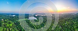 Scenic aerial sunset view of rainforest river in Amazonas Brazil