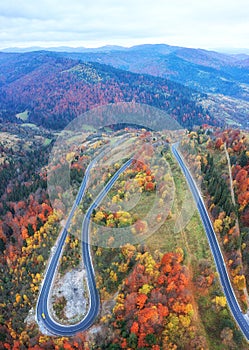 Scenic aerial view of the colorful autumn mountains and mountain pass, nature landscape, Carpathians. Outdoor travel background