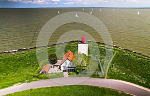 Scenic aerial view of De Ven light house and wildflowers in the Netherlands photo