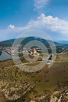 Scenic aerial view of Jvari clifftop orthodox monastery located in Mtskheta Georgia. Summer day time. Travel and vacation concept