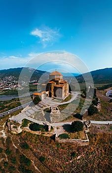 Scenic aerial view of Jvari clifftop orthodox monastery located in Mtskheta Georgia. Summer day time. Travel and vacation concept