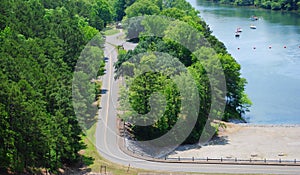 Scenic Aerial View Overlooking A Curvy Road And Beautiful Blue River