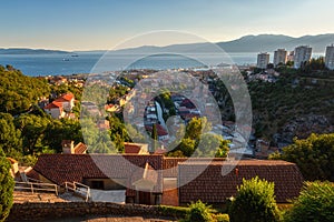 Scenic aerial view of Rijeka port city on Adriatic seacoast, beautiful cityscape in sunset light, Kvarner bay, Croatia