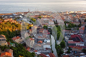 Scenic aerial view of Rijeka port city on Adriatic seacoast, beautiful cityscape in sunset light, Kvarner bay, Croatia