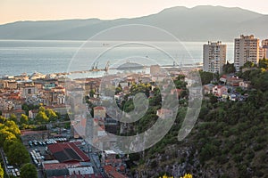 Scenic aerial view of Rijeka port city on Adriatic seacoast, beautiful cityscape in sunset light, Kvarner bay, Croatia