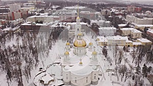 Scenic aerial view of snow covered cityscape of Penza overlooking restored architectural complex of Spassky Cathedral in