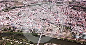 Scenic aerial view of Spanish city of Merida with ancient Roman Bridge and modern Lusitania Bridge over Guadiana river