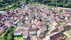 Scenic aerial view of spanish township of Isaba with brownish tiled roofs of residential buildings and medieval