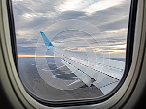 Scenic Aerial View of a Sunset from an Airplane Window