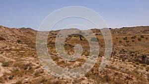 Scenic african landscape with Sahara desert. Dry grass on sandy mountains