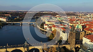 Scenic autumn aerial view of the Prague Old Town pier architecture and Charles Bridge over Vltava river in Prague, Czech Republic