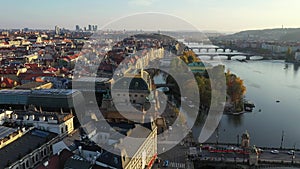 Scenic autumn aerial view of the Prague Old Town pier architecture and Charles Bridge over Vltava river in Prague, Czech Republic