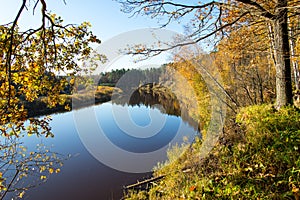 Scenic autumn colored river in country