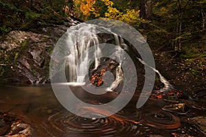 Scenic autumn landscape shot in Bulgarian mountain with smooth waterfall