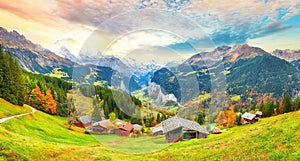 Scenic autumn view of picturesque alpine Wengen village and Lauterbrunnen Valley