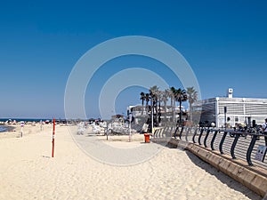 scenic beach with promenade in Tel Aviv in midday heat